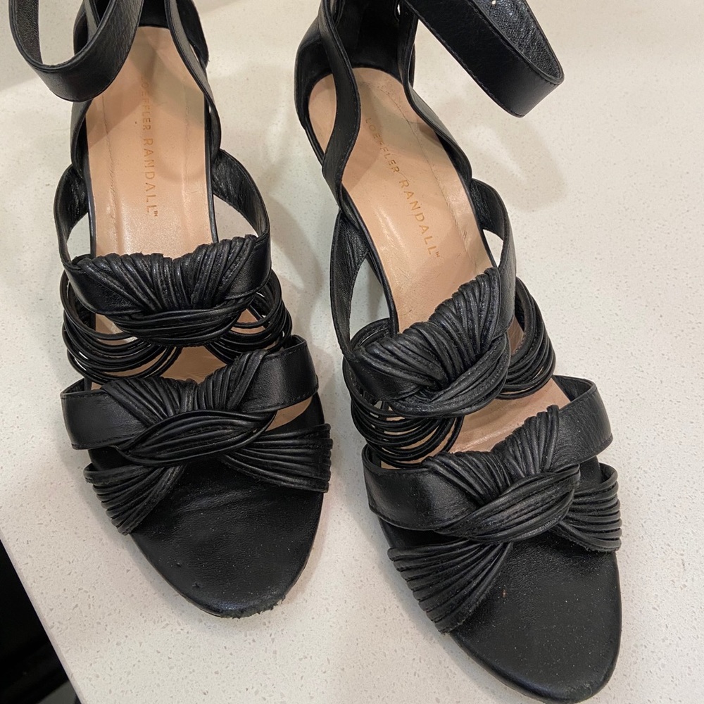 Black wedges with ankle strap and back zippers.
